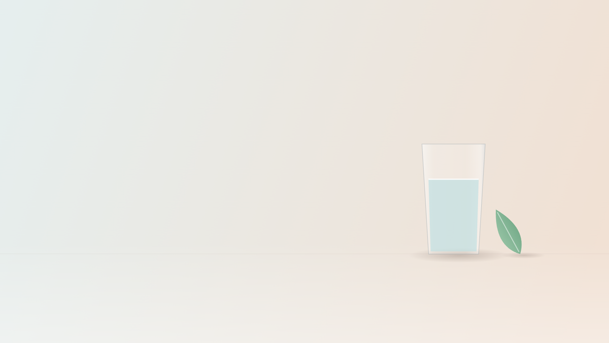Glass of water and a green leaf on a soft pastel background, representing managing Mounjaro side effects